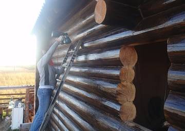 Обработка деревянного дома маслом
